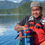 A Creative Salmon employee holding a Biomass Pro unit.