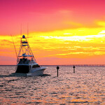 Large fishing boat going out for a sunset cruise in Destin, Florida