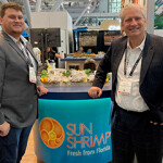 Robin Pearl (right) with his son at the 2023 Seafood Expo North America.