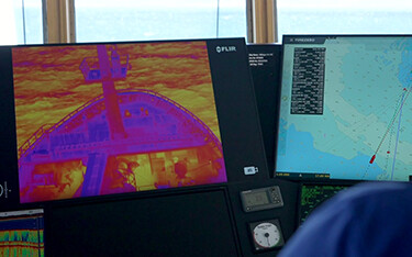A display showing what a thermal camera is seeing in the helm of the Vikingur AK 100