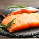 Salmon on a plate with greens