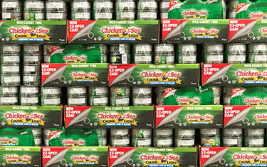 Chicken of the Sea tuna cans in a supermarket.