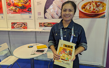 Guangdong Harmony Food Co Sales Director Fiona Wong holding one of the company's new retail snakehead products