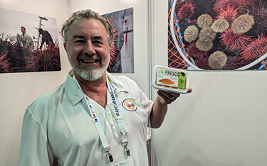 Fraser Rieche with UniFresco showing off the company's new processed uni product