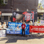 A group of protesters with signs to save the Maugean skate