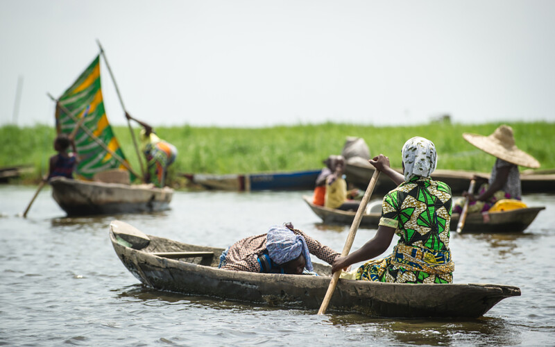 Fishers along a river in Benin