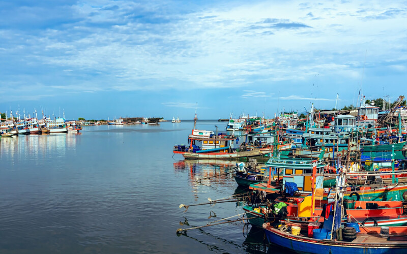 Fishing vessels docked in a fishing village in central Thailand