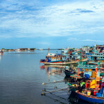 Fishing vessels docked in a fishing village in central Thailand