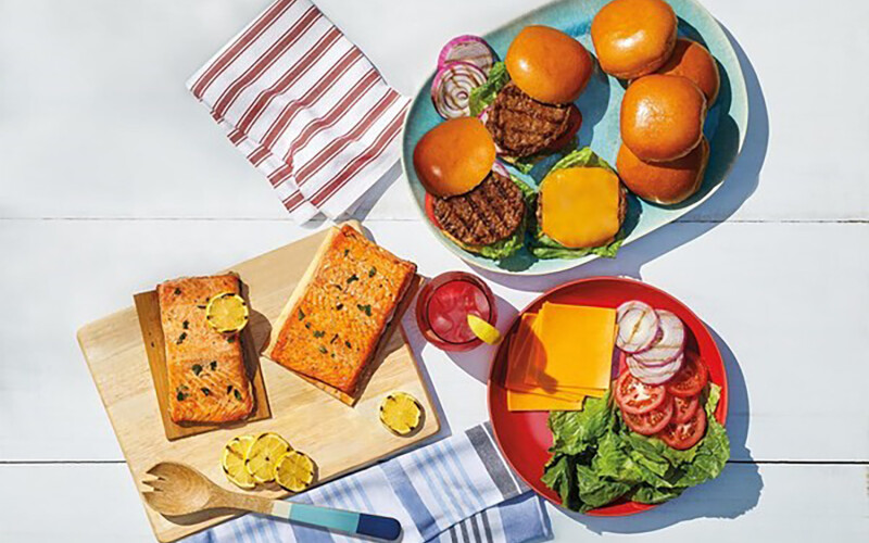 Aldi products, including salmon and burgers, that have just been grilled