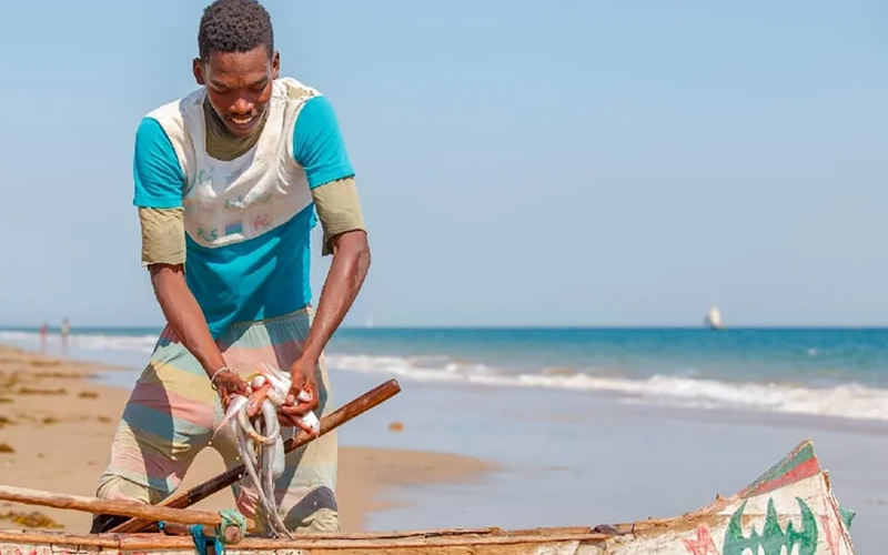 A Benin fisherman readying his boat