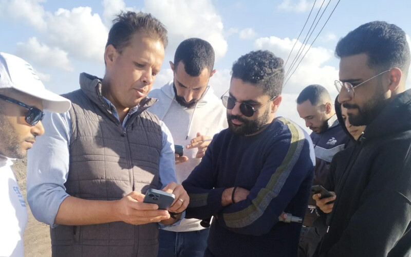 Egyptian farmers being trained on a tilapia welfare app that collects real-time data on farm performance