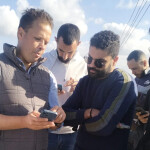 Egyptian farmers being trained on a tilapia welfare app that collects real-time data on farm performance