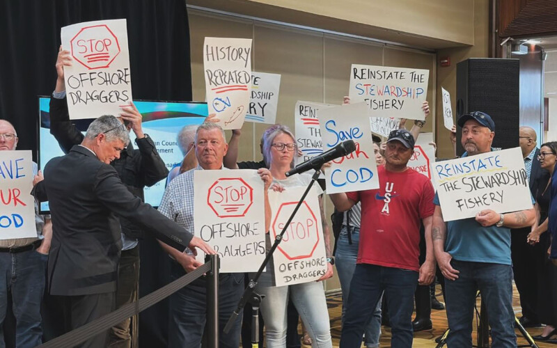 Members of the Fish, Food, and Allied Workers Union disrupting a press conference of Canadian environment ministers