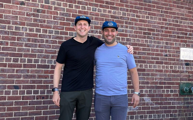 Acme Smoked Fish Managing Partner Adam Caslow (left) and Banner Smoked Fish Operations Manager Eli Attias