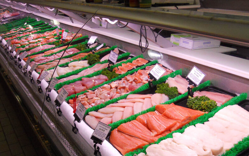A grocery counter displaying fresh seafood