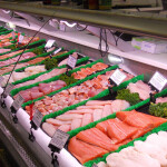 A grocery counter displaying fresh seafood