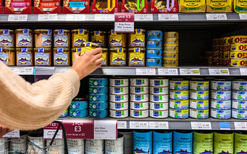 A canned seafood aisle in a U.K. grocery store