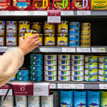 A canned seafood aisle in a U.K. grocery store