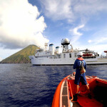 A small boat approaches NOAA Ship Hi‘ialakai at Asuncion Island