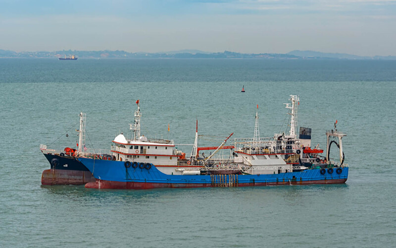 A Chinese fishing vessel in the Strait of Singapore