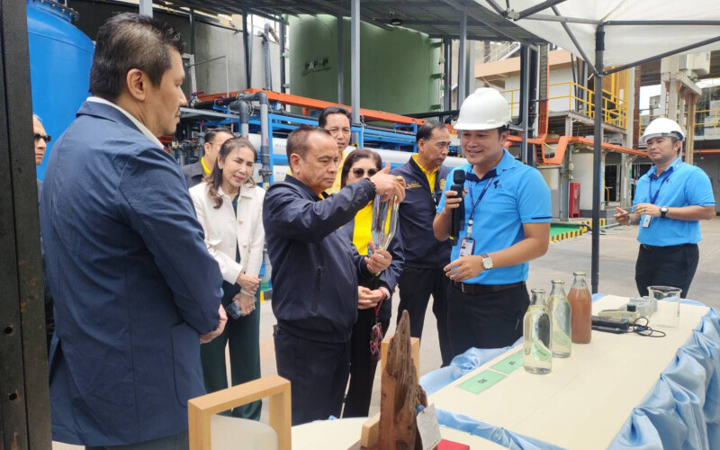 Thai Union members guide members of the Thai Ministry of Labor through one of the company's manufacturing facilities