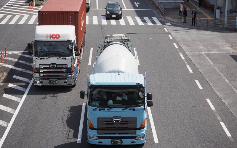 Japanese trucks making their way through the streets of Tokyo, Japan