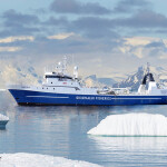 The Qikiqtaaluk Fisheries Corporation vessel Saputi on the water near icebergs