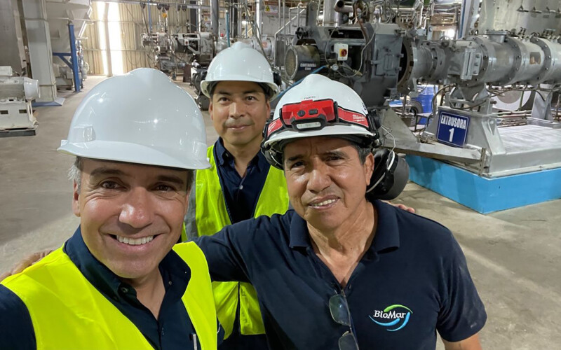BioMar CEO Carlos Diaz (front) visits one of his company's facilities in Ecuador