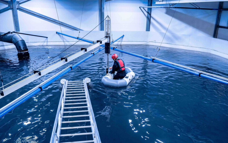 An AKVA Group employee working on a land-based aquaculture facility