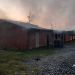 Handy Seafood’s crab shedding plant in Crisfield, Maryland, U.S.A., with smoke coming out of the building