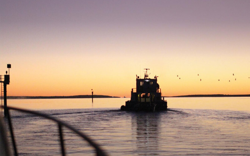 A Clean Seas vessel working at one of its aquaculture farms at sunset