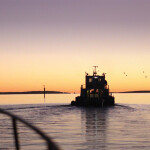 A Clean Seas vessel working at one of its aquaculture farms at sunset