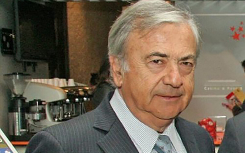 Former Australis owner Isidoro Quiroga, wearing a grey suit.