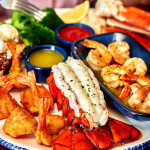 A spread of Red Lobster products including lobster tail, grilled shrimp, and coconut shrimp