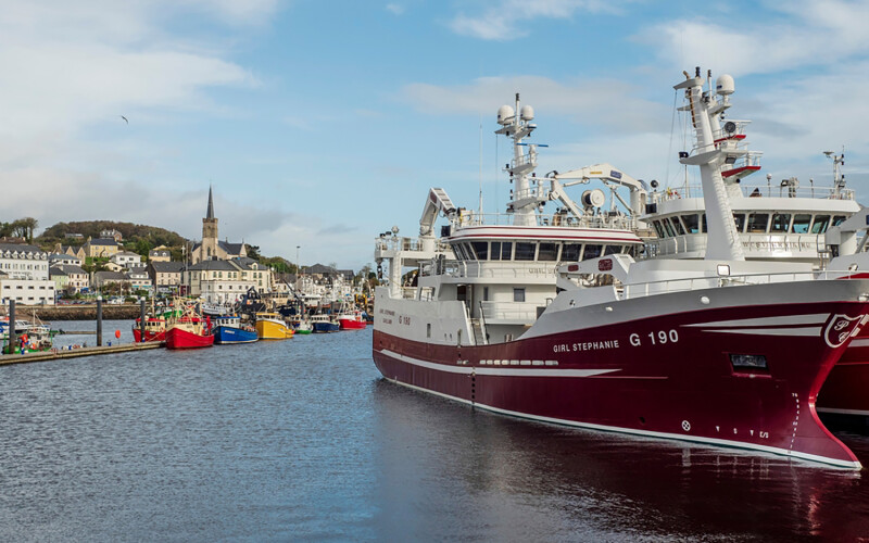 A picture of the port of Killybegs in County Donegal, Ireland, featuring fishing boats on the water