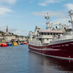 A picture of the port of Killybegs in County Donegal, Ireland, featuring fishing boats on the water
