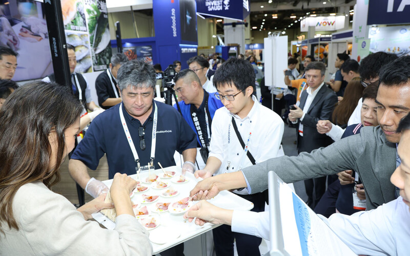 Participants at the 2024 Seafood Expo Global tasting a seafood cup