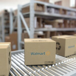 Boxes rolling along an assembly line at a Walmart warehouse