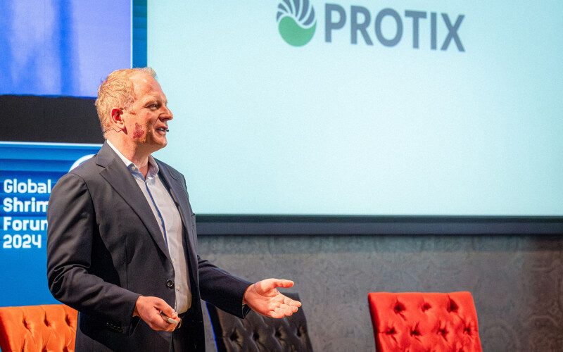 A photo of Protix CCO Piotr Postepski presenting at the 2024 Global Shrimp Forum