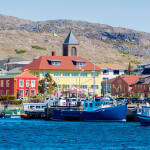 A fishing boat sailing into the harbor or St. Pierre and Miquelon