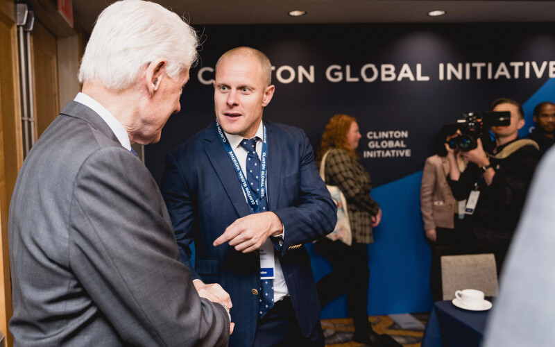 Aker BioMarine CEO Matts Johansen talking with former U.S. President Bill Clinton