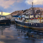 A photo of commercial fishing vessels in Alaska.
