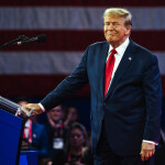 Donald Trump stands at a podium in Maryland.