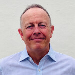 A headshot of Steven Adolf