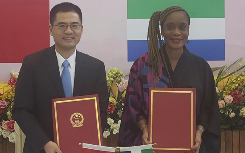 China’s Ambassador to Sierra Leone Wang Qing and Sierra Leone’s Minister of Fisheries and Marine Resources Princess Dugba signing an agreement on commencement of work at a Chinese-sponsored fishing port