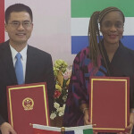 China’s Ambassador to Sierra Leone Wang Qing and Sierra Leone’s Minister of Fisheries and Marine Resources Princess Dugba signing an agreement on commencement of work at a Chinese-sponsored fishing port