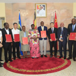 Chinese and Ugandan officials signing a protocol deal at this year’s Forum on China-Africa Cooperation in Beijing