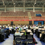 Members of the WCPFC meet inside a gymnasium in Fiji
