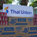 A pile of canned fish under a Thai Union sign