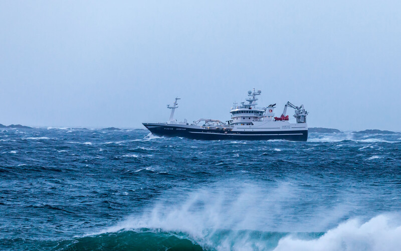 A fishing boat in rough seas off the coast of Norway
